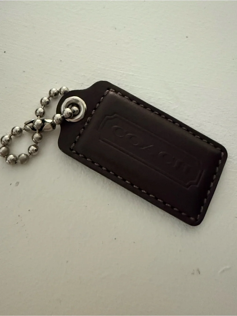 Coach brown leather hang tag fob 2.5”